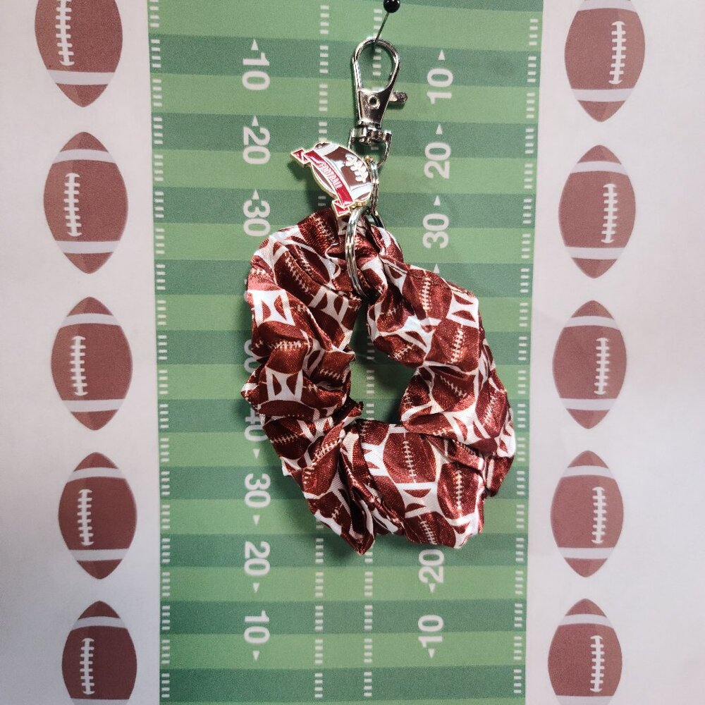 Football Themed Wristlet Keyring with a Football related charm attached !!
